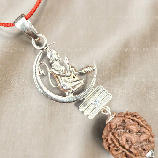 Silver Hanuman Ji pendant with rudraksha locket on orange thread necklace close-up