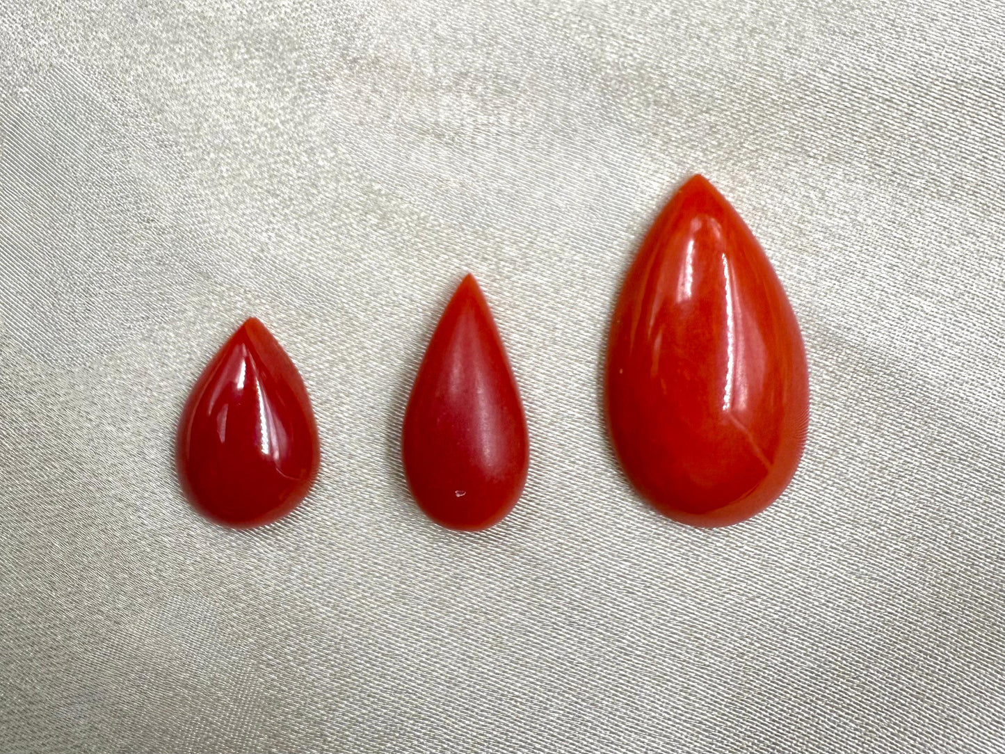 Natural Japanese Red Coral (Moonga)  Pear Shape 3 piece 1.25x9.26 mm 3.08 ct  15.30x8 mm 4.11 ct  22.33x12.88 mm 8.69 c