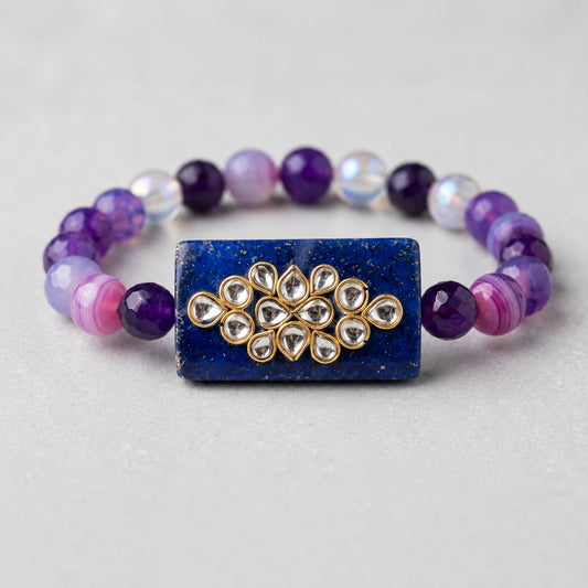 Kundan rakhi bracelet with blue centerpiece and natural gemstone beads