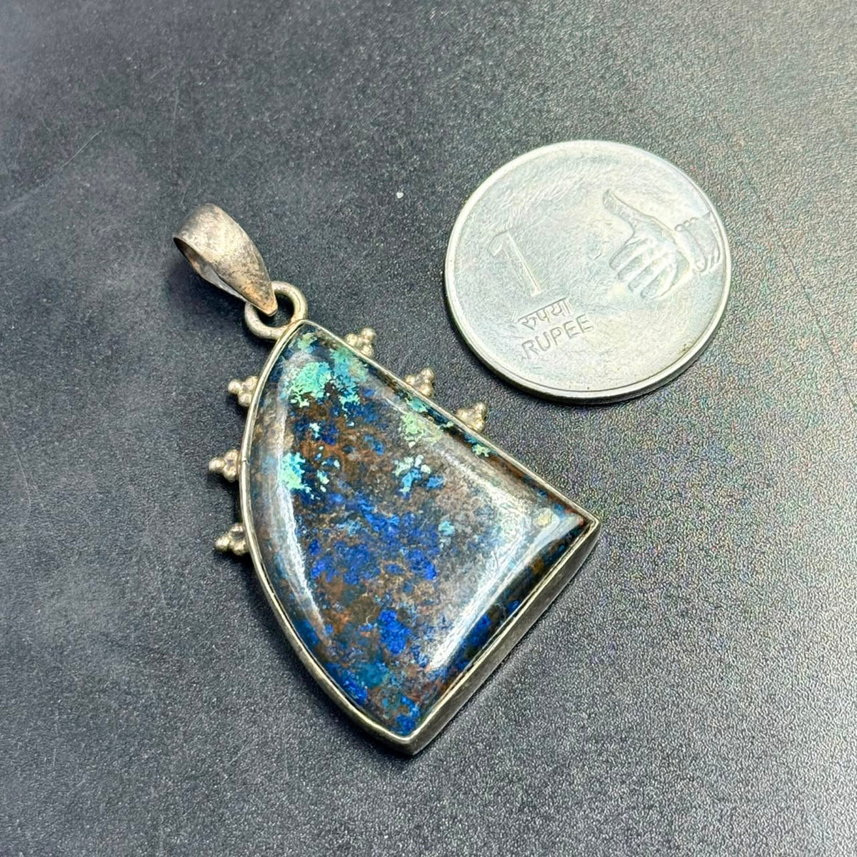 Lapis azurite 925 silver locket pendant with blue stone center on dark background
