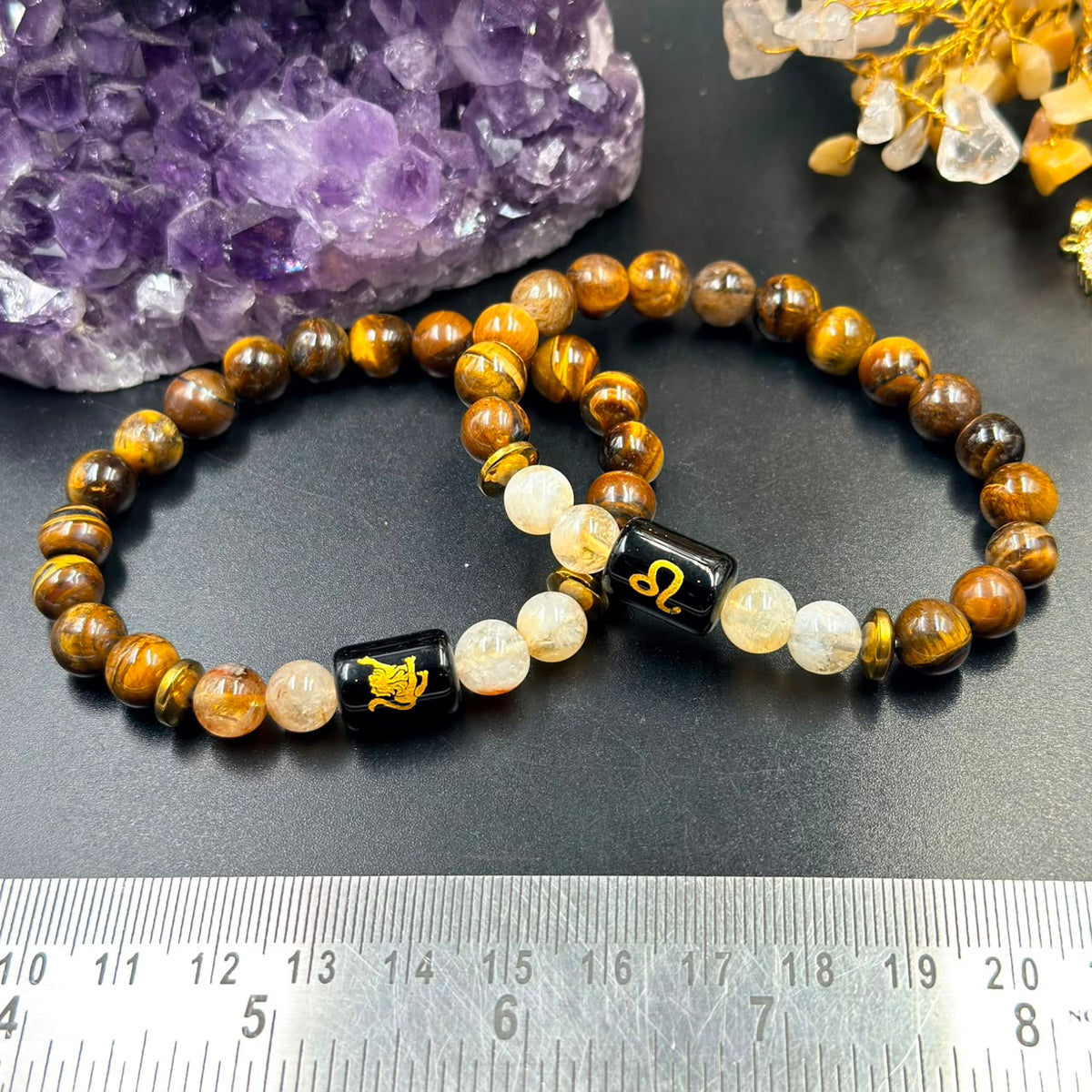 Close view of Leo (Singh) zodiac bracelet beads with tiger eye and citrine plus black Leo charm