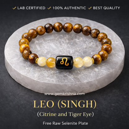 Leo (Singh) zodiac bracelet with tiger eye and citrine beads plus raw selenite plate on black surface