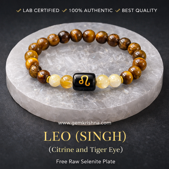 Leo (Singh) zodiac bracelet with tiger eye and citrine beads plus raw selenite plate on black surface