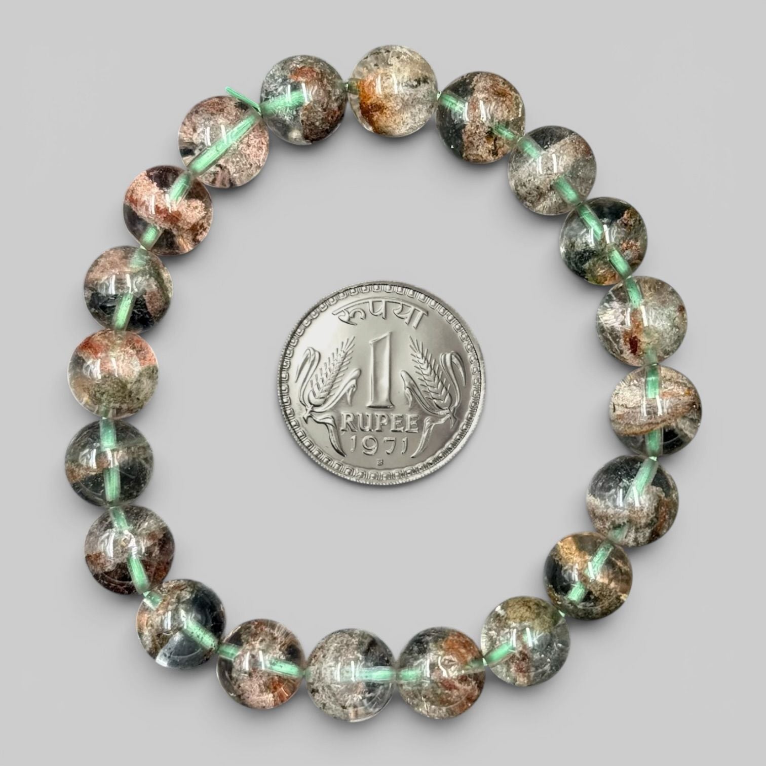 Lodolite Garden Quartz Phantom Quartz Bracelet with translucent round beads and an Indian 1 rupee coin for size reference