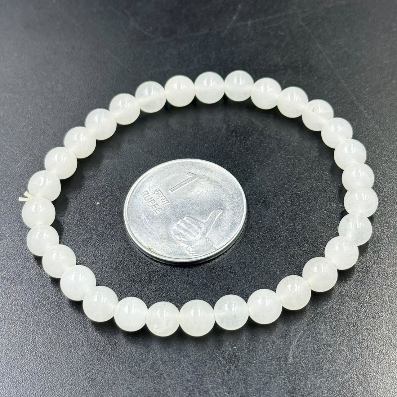 Milky Quartz 6mm bracelet showing round white beads and close clasp end