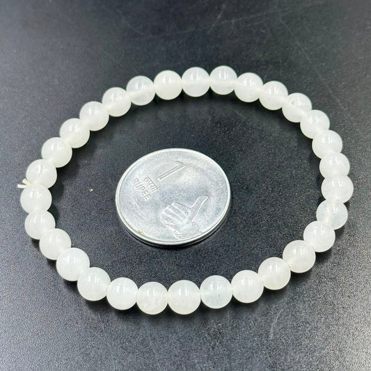 Milky Quartz 6mm bracelet showing round white beads and close clasp end