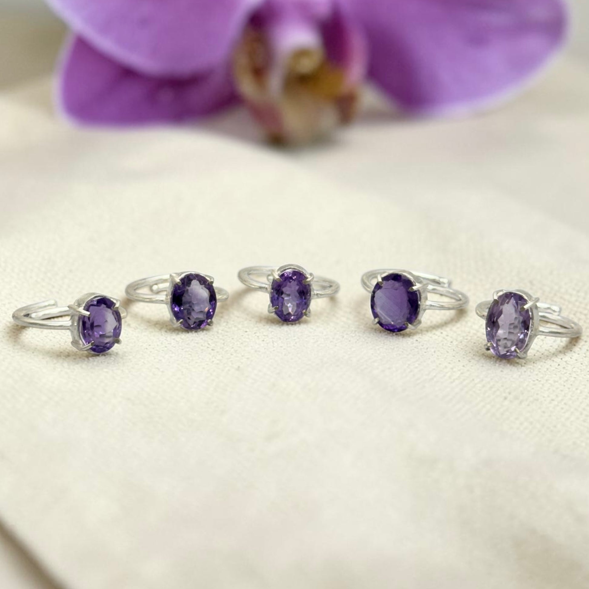 Natural amethyst adjustable ring featuring a purple oval stone in a silver-toned setting