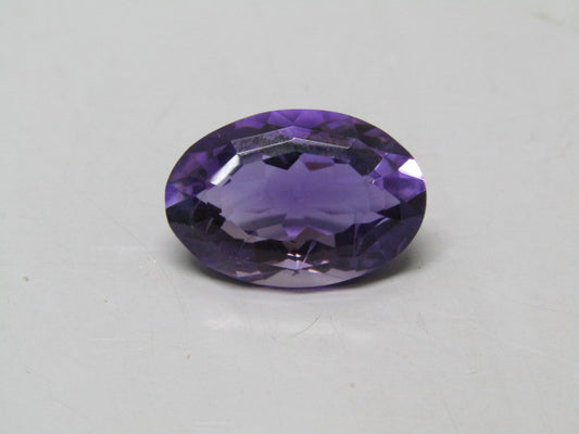 Natural amethyst quartz oval gemstone with faceted purple oval cut