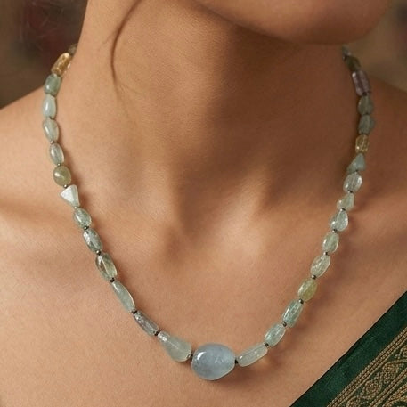 Natural aquamarine bead necklace with oval gemstones on a neckline view