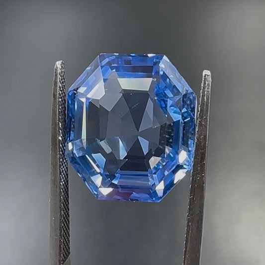 Natural blue sapphire octagonal cut gemstone close-up viewed from the front