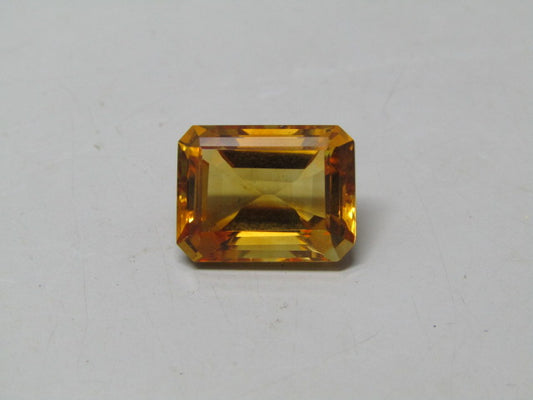 Natural citrine gemstone in an emerald cut with warm golden color