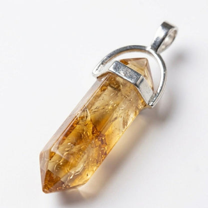 Natural citrine pencil locket pendant with silver-toned bail on a white background