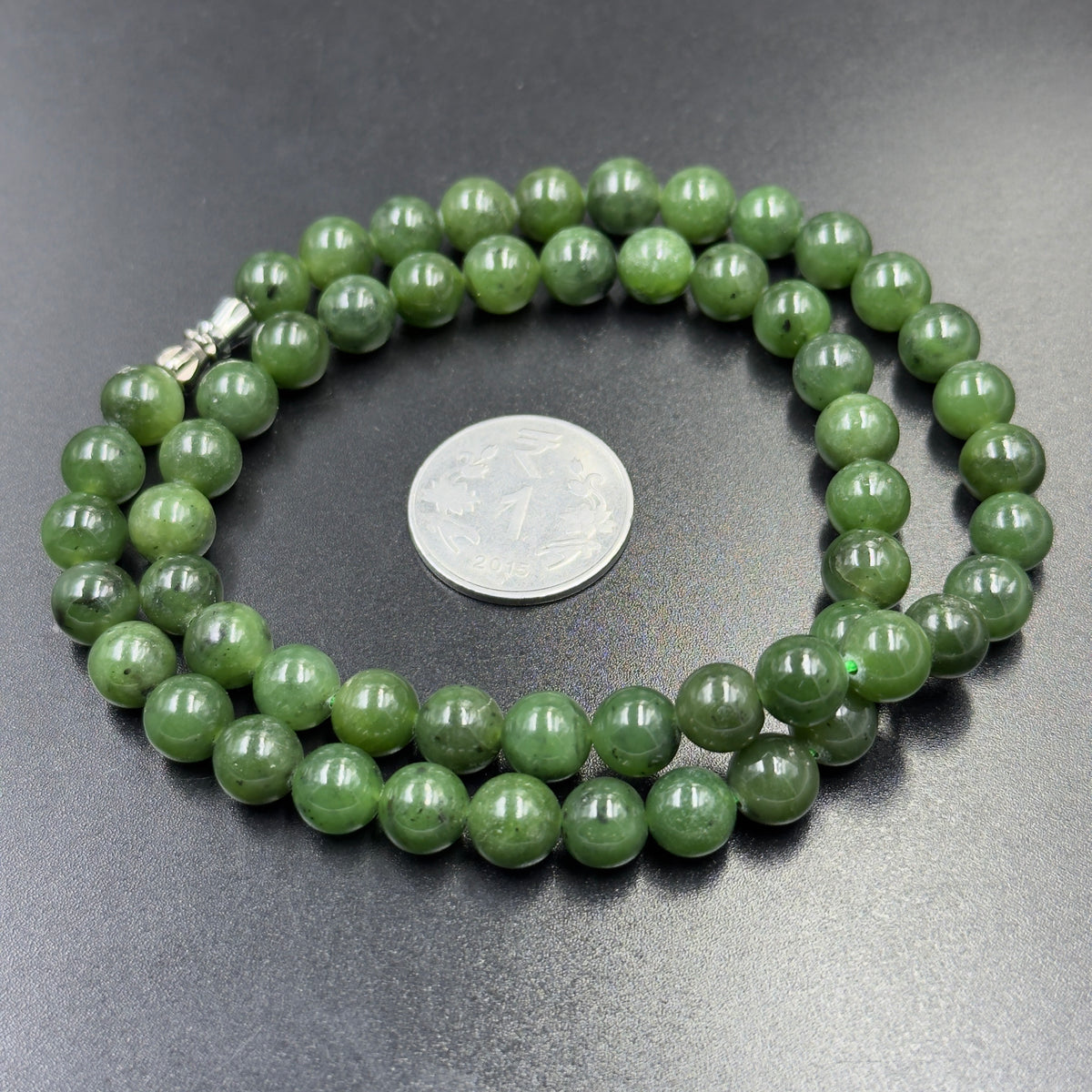 Natural green nephrite jade bead necklace strand with clasp detail and coin for scale