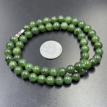 Natural green nephrite jade bead necklace strand with clasp detail and coin for scale