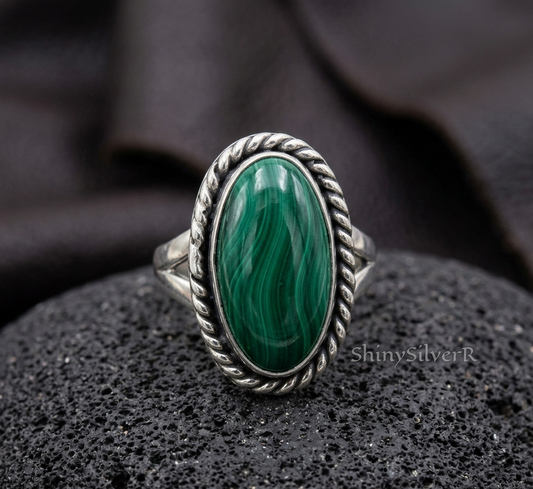 Natural malachite oval sterling silver ring with antique finish, detailed textured band