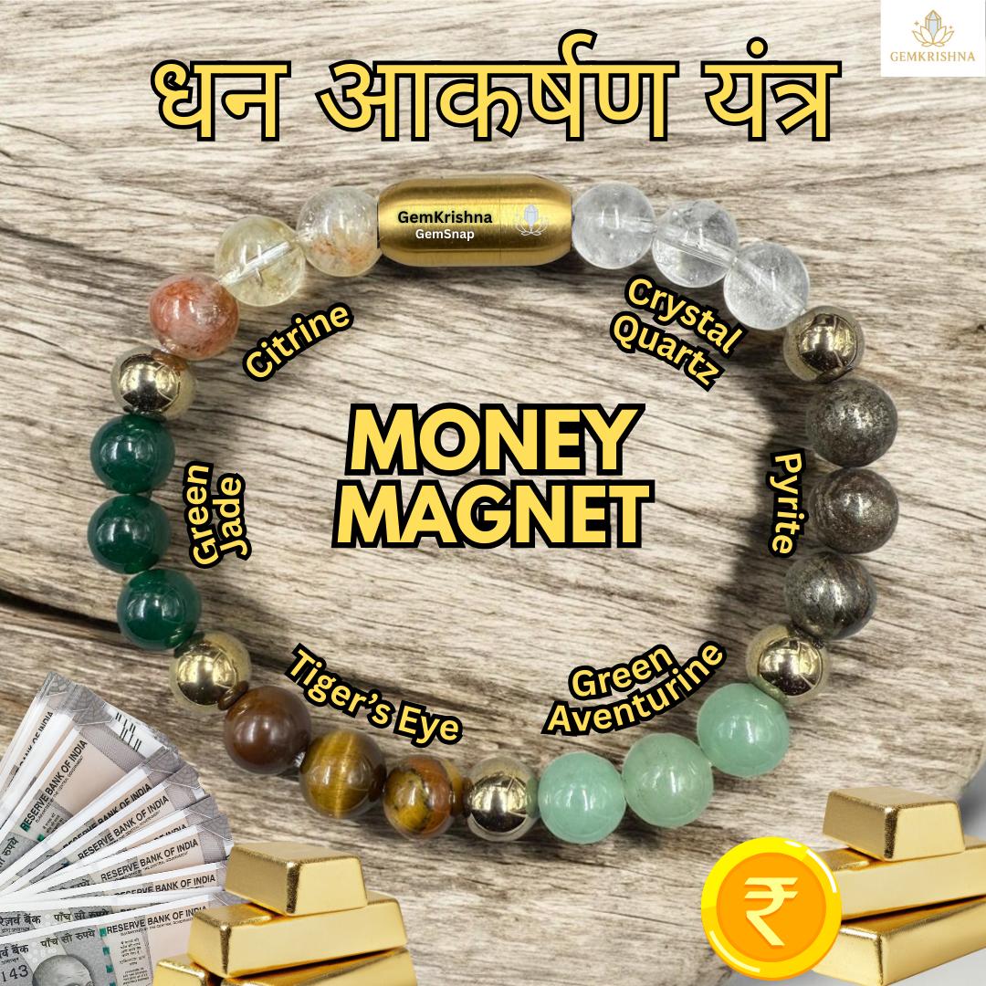 Natural money magnet bracelet with multicolored beads and gold magnetic centerpiece on wood surface