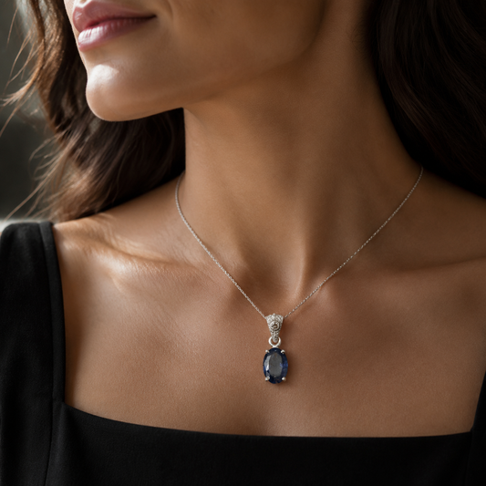 Natural tanzanite and lab-grown diamond pendant in 925 silver on a model neckline