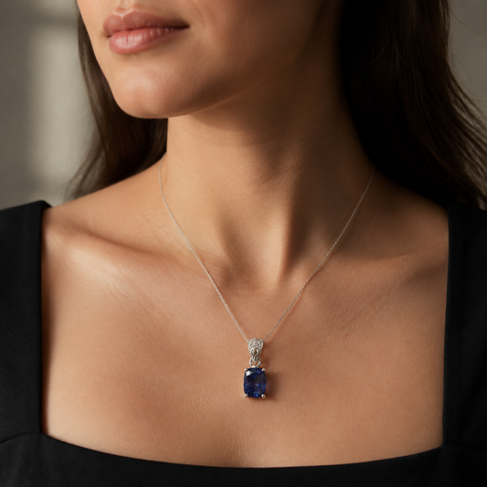 Natural tanzanite and lab-grown diamond pendant in 925 silver on a delicate chain, worn view