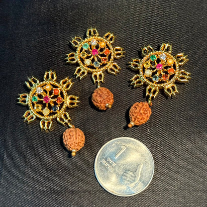 Navratna sun locket pendant with original rudraksha bead on dark fabric with coin for size
