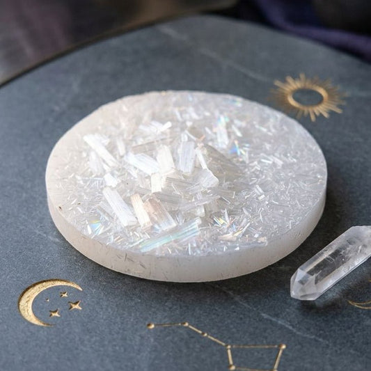 Free raw selenite plate with lapis lazuli howlite zodiac accessories on a dark backdrop