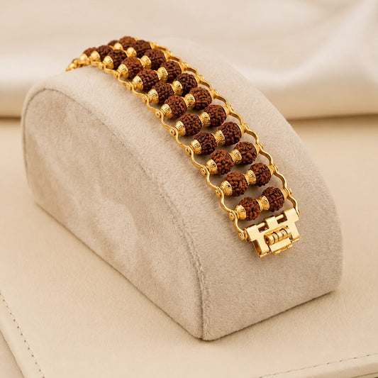 Rudraksha gold polish double-row bracelet on beige jewelry stand