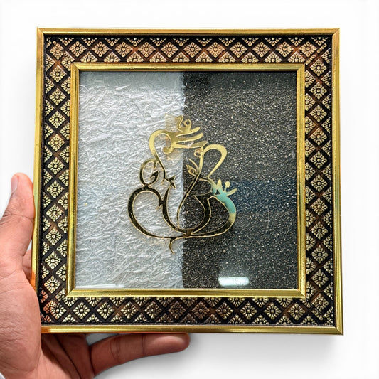 Selenite and pyrite Ganesh Ji framed artwork with gold-toned deity figure on textured background