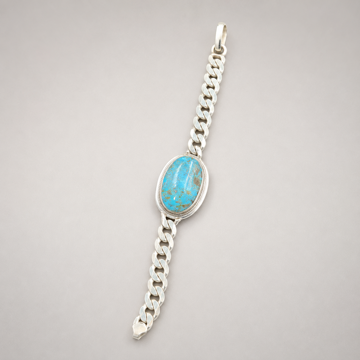 Silver curb link oval turquoise bracelet with large oval blue stone pendant centerpiece
