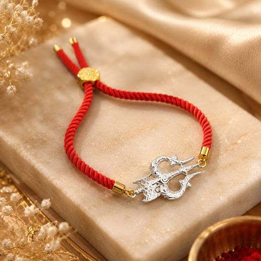 Silver ornate Shiv trishul rakhi bracelet with adjustable red thread for brother