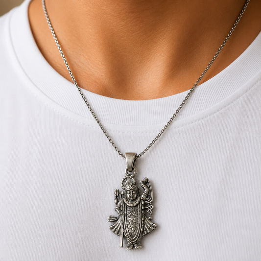 Lord Shrinathji Govardhan Krishna 925 silver pendant worn on a chain against white shirt