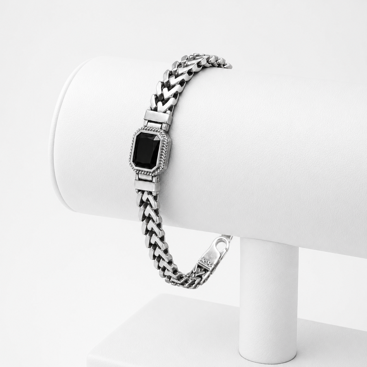 Single black stone chevron link 925 sterling silver bracelet for men on white display