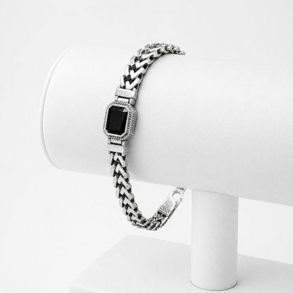 Single black stone chevron link 925 sterling silver bracelet for men on white display