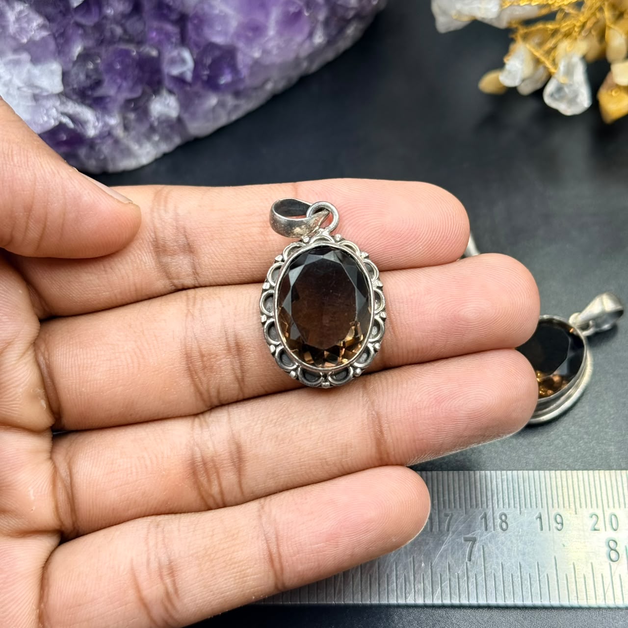 Smoky quartz 925 silver locket pendant held in hand, oval stone in ornate bezel