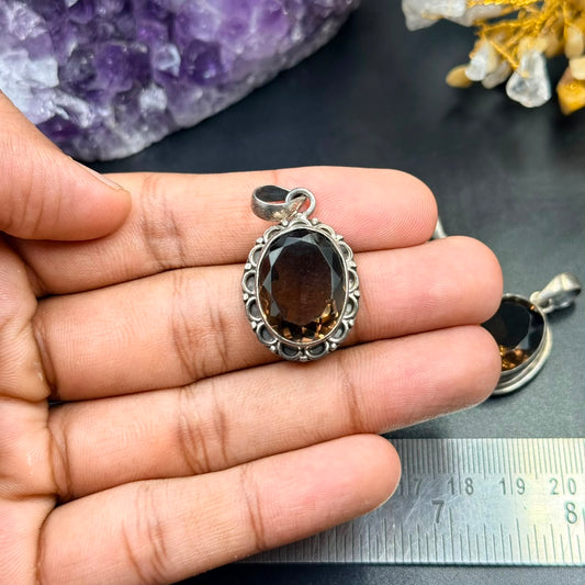 Smoky quartz 925 silver locket pendant held in hand, oval stone in ornate bezel