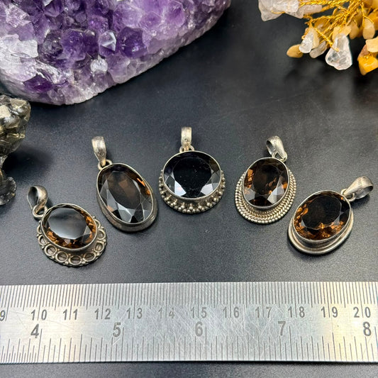 Oval smoky quartz 925 silver locket pendant setting on display with ruler background