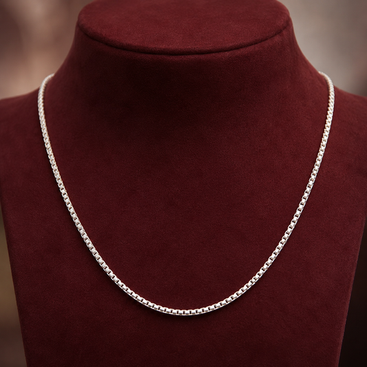 Sterling silver box chain necklace on burgundy velvet display