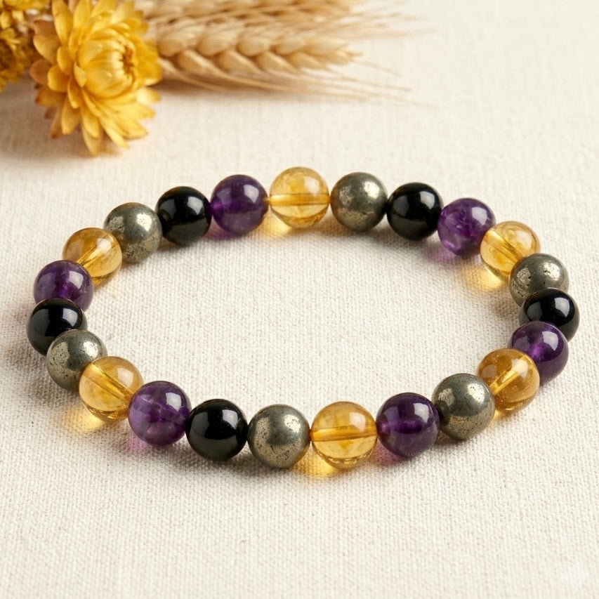 Success & Protection Bracelet close-up showing amethyst, citrine, black beads, and metallic stone accents