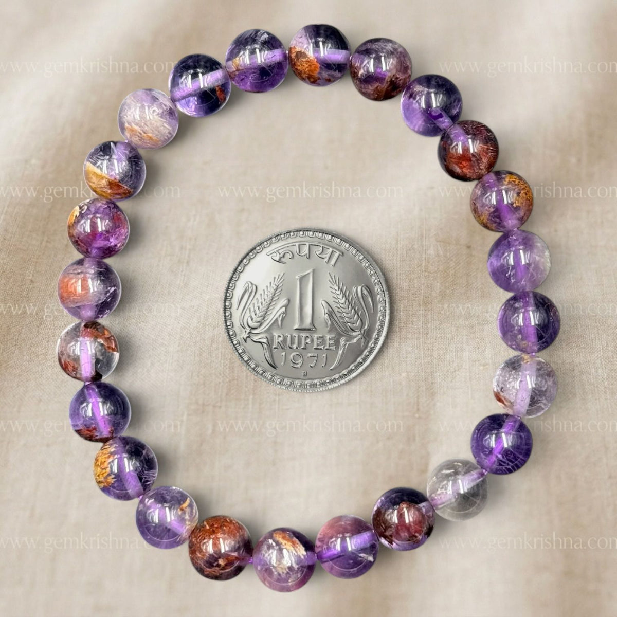 Super Seven Bracelet close-up beaded stones with Indian rupee coin for scale