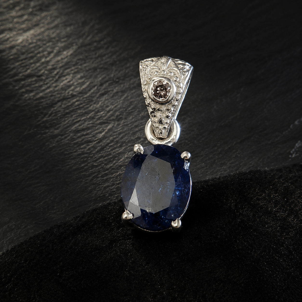 Side view close-up of natural tanzanite and lab-grown diamond pendant in 925 silver