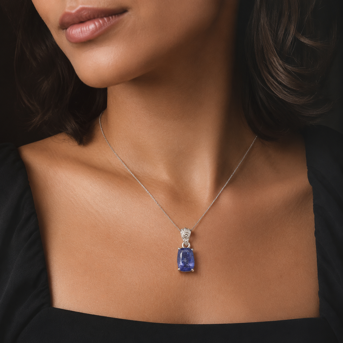 Natural tanzanite and lab-grown diamond pendant in 925 silver, worn on a fine chain
