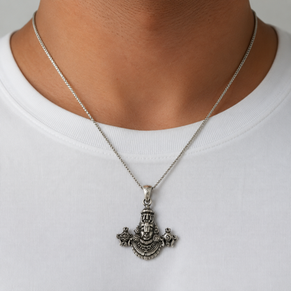 Silver Tirupati Balaji Venkateswara pendant necklace worn on a white shirt