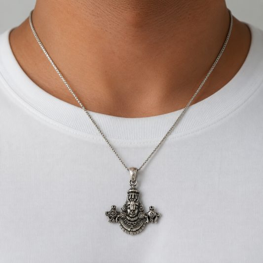 Silver Tirupati Balaji Venkateswara pendant necklace worn on a white shirt