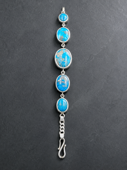 Turquoise 925 sterling silver bracelet front view with five oval turquoise stones