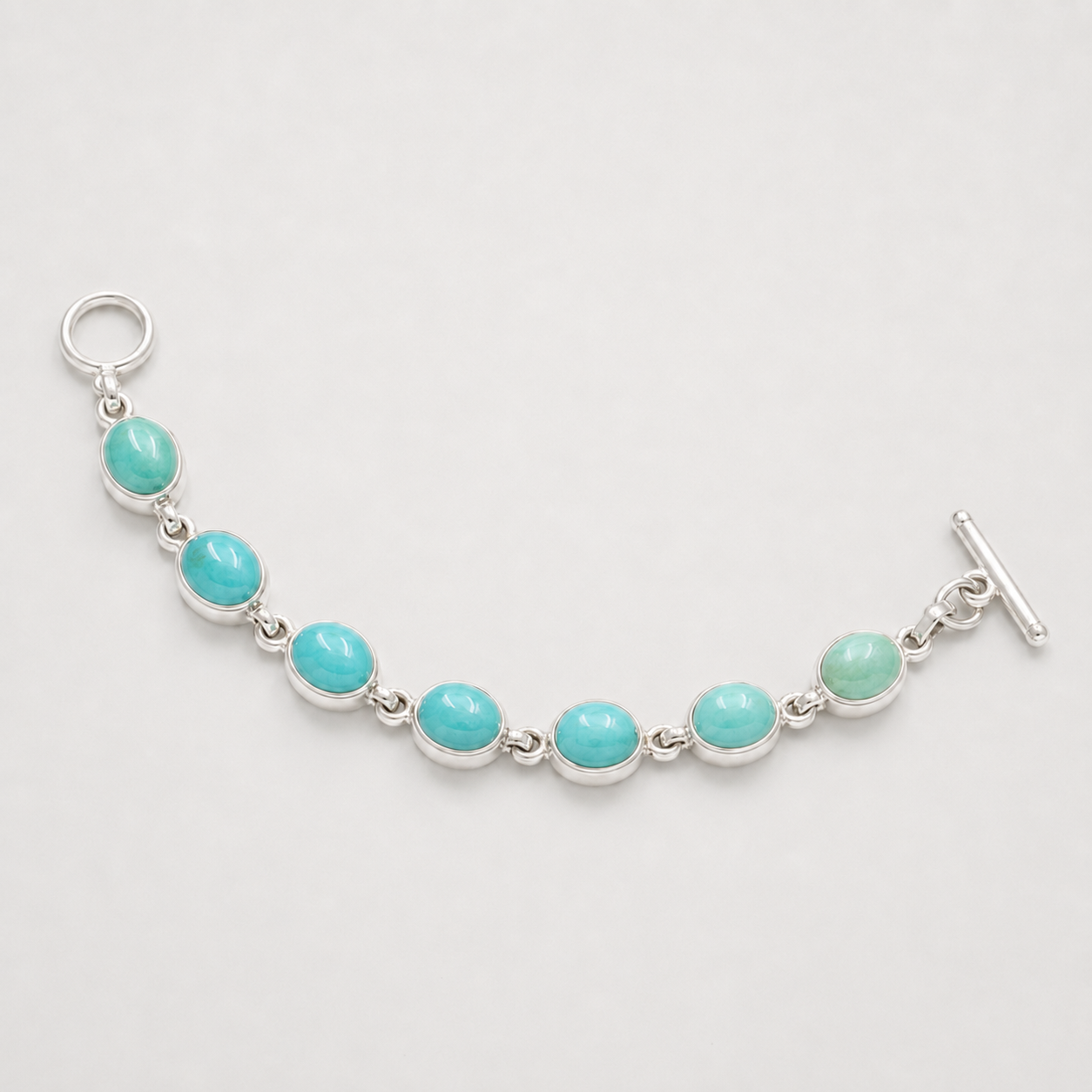 Turquoise 925 sterling silver bracelet with seven oval turquoise cabochons and box clasp