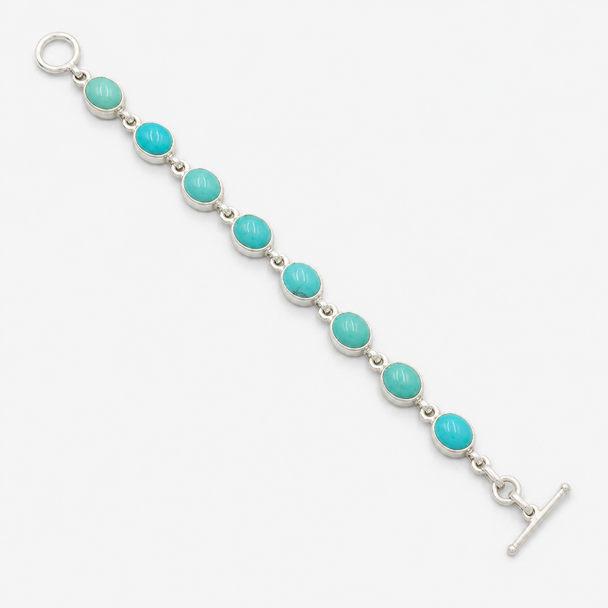 Turquoise 925 sterling silver seven-stone bracelet with oval turquoise cabochons and hook clasp