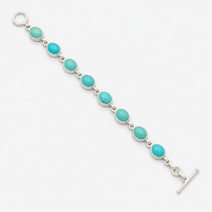 Turquoise 925 sterling silver seven-stone bracelet with oval turquoise cabochons and hook clasp
