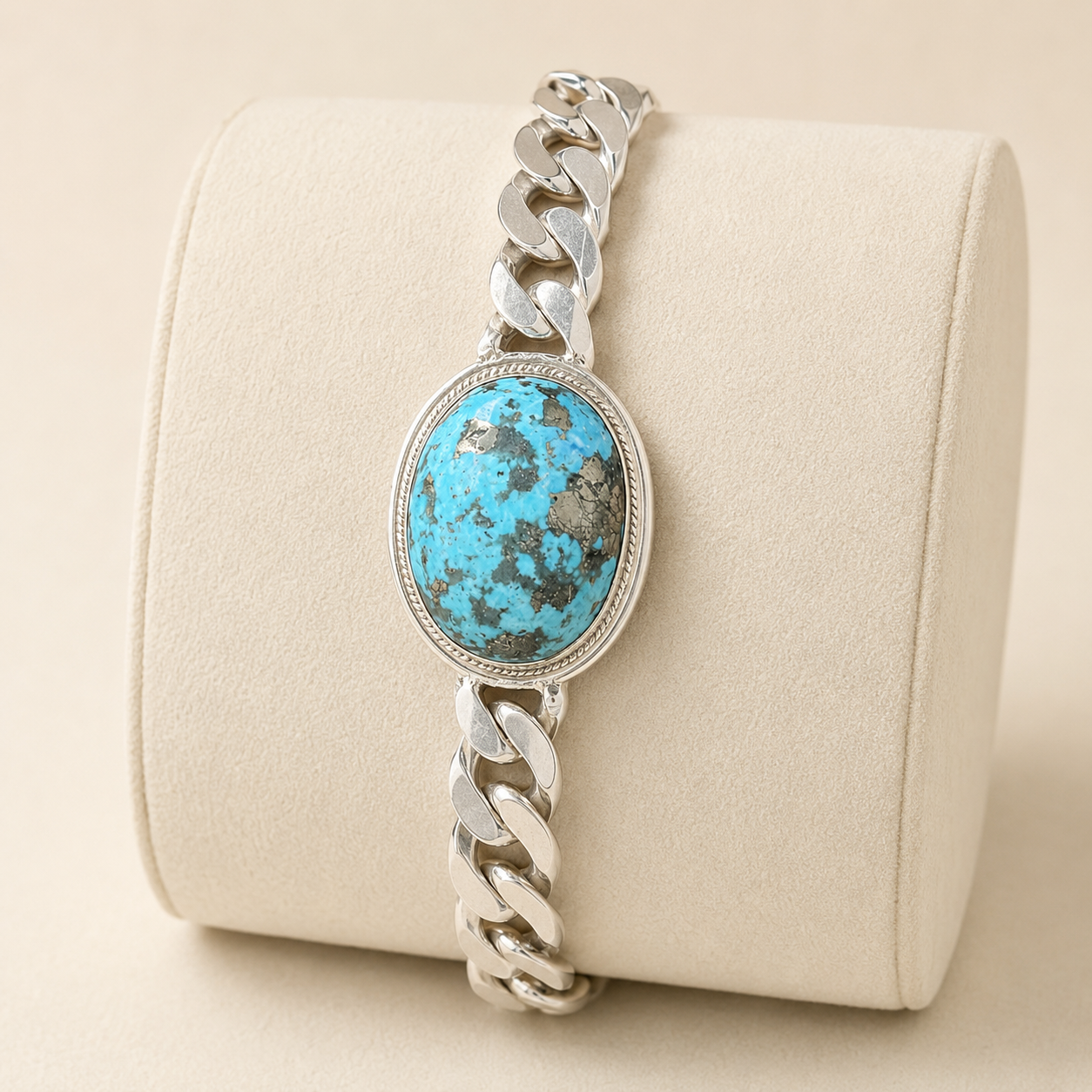Unisex large turquoise oval stone Cuban link bracelet in 925 sterling silver on beige display